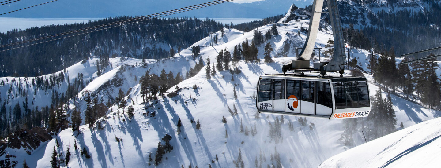 The Palisades Tahoe Aerial Tram with Lake Tahoe in the background.